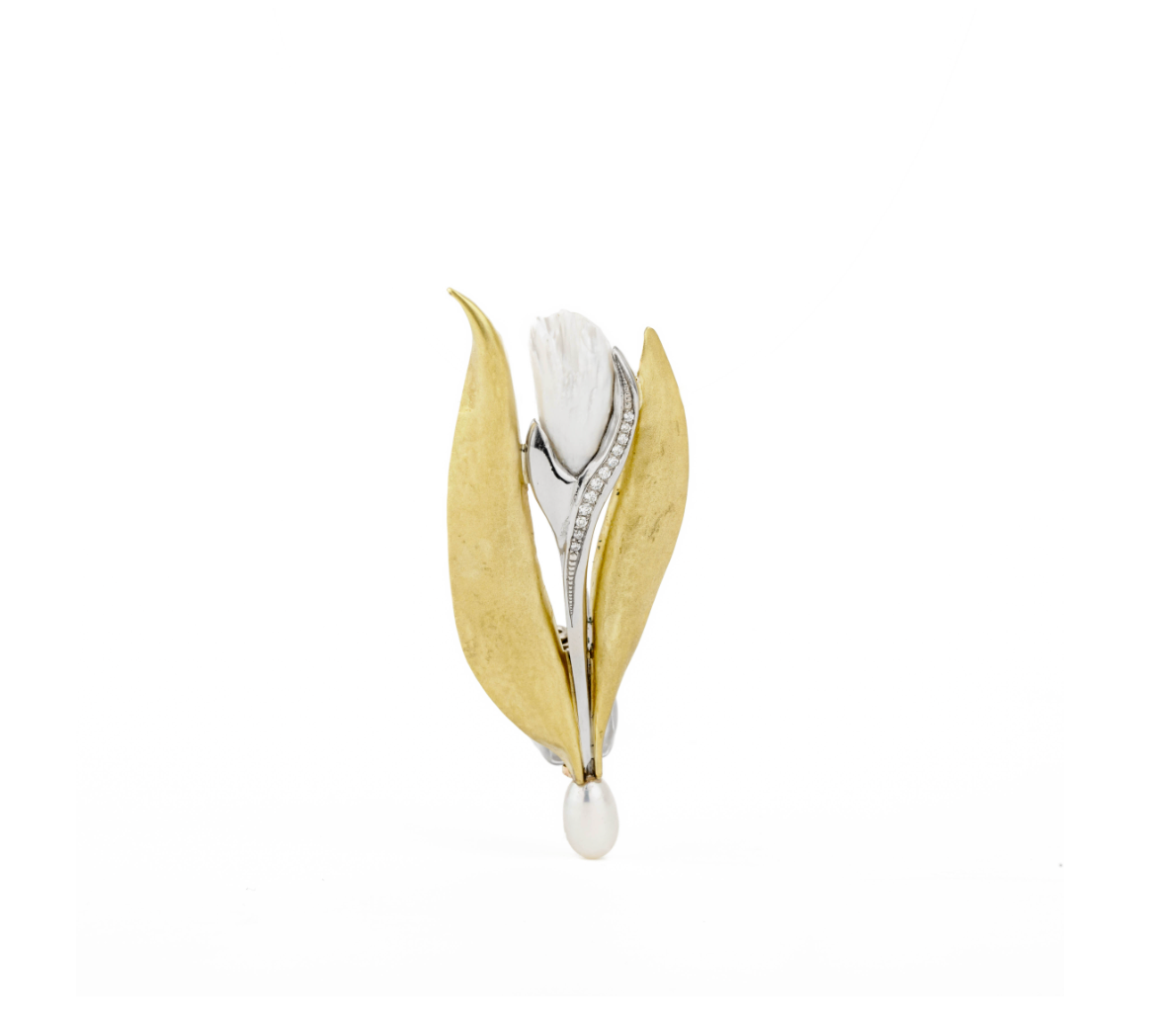 Platinum and 18k yellow gold tulip brooch featuring carved Tennessee River pearl, diamond-set stem, and freshwater pearl drop
