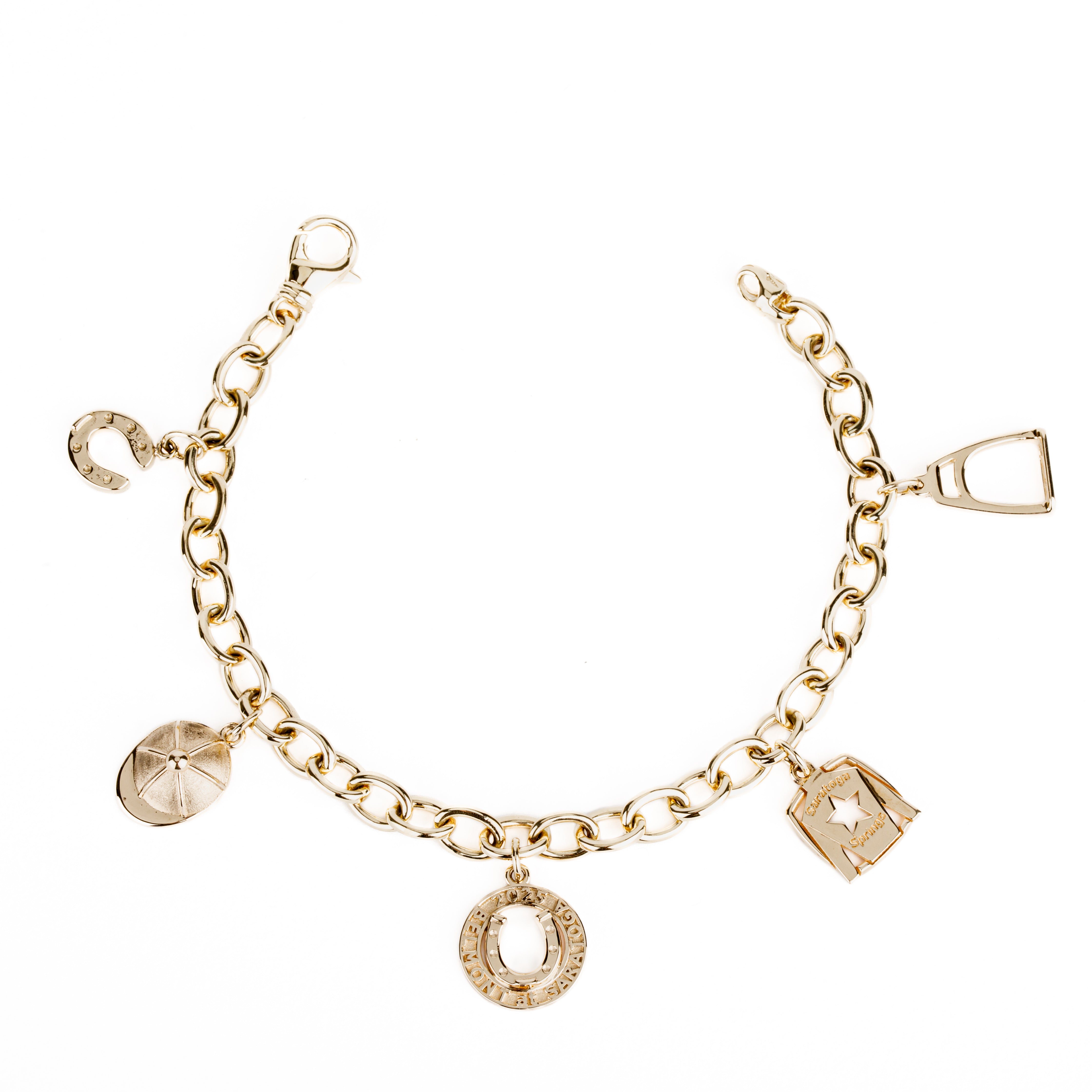  14k yellow gold charm bracelet with five equestrian charms — horseshoe, jockey hat, jockey silks, stirrup, and 2025 Belmont at Saratoga commemorative charm — on an oval-link chain
