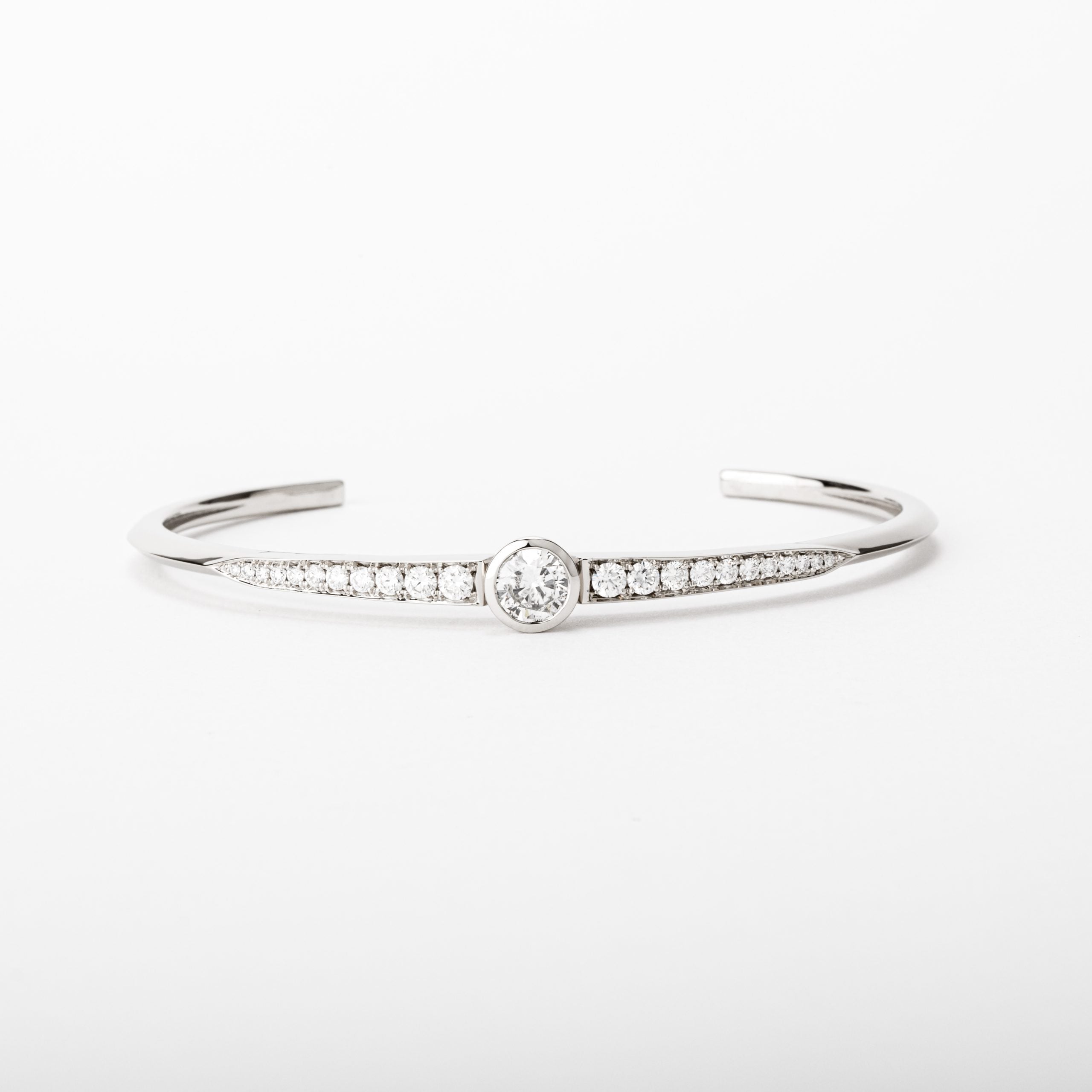 14k white gold diamond cuff bracelet with center bezel set diamond and pavé accents