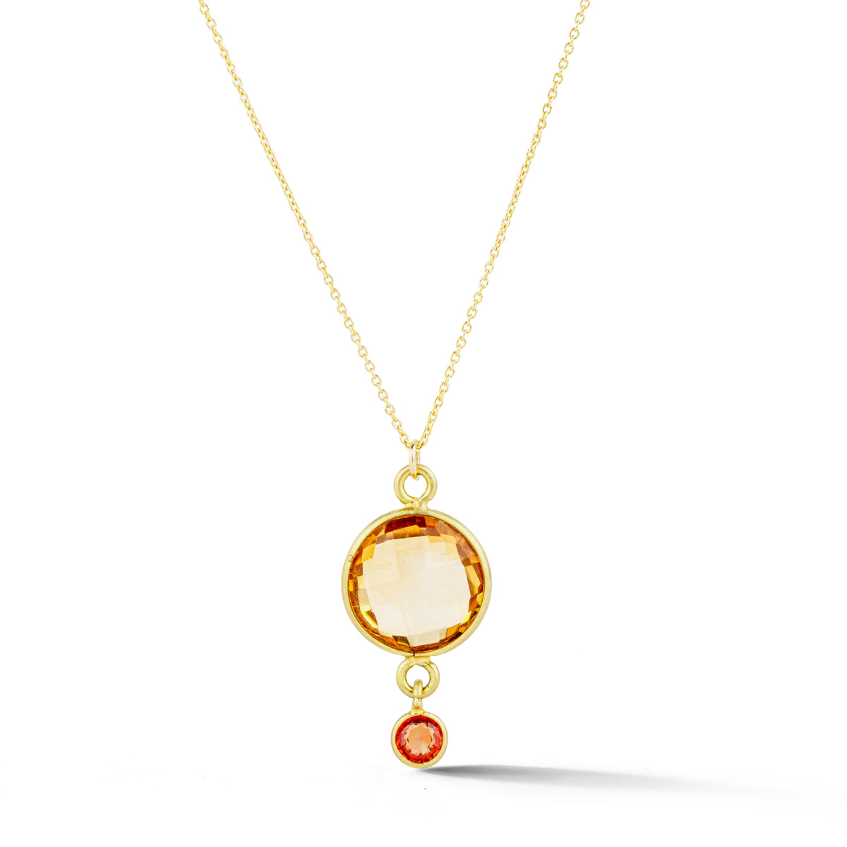 Necklace with a round faceted citrine pendant and small orange sapphire accent, bezel set in 18k yellow gold on a 14k yellow gold cable chain, 18 inches long