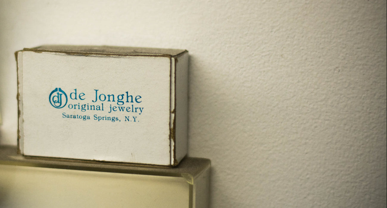 deJonghe jewelry box on a surface with a neutral background