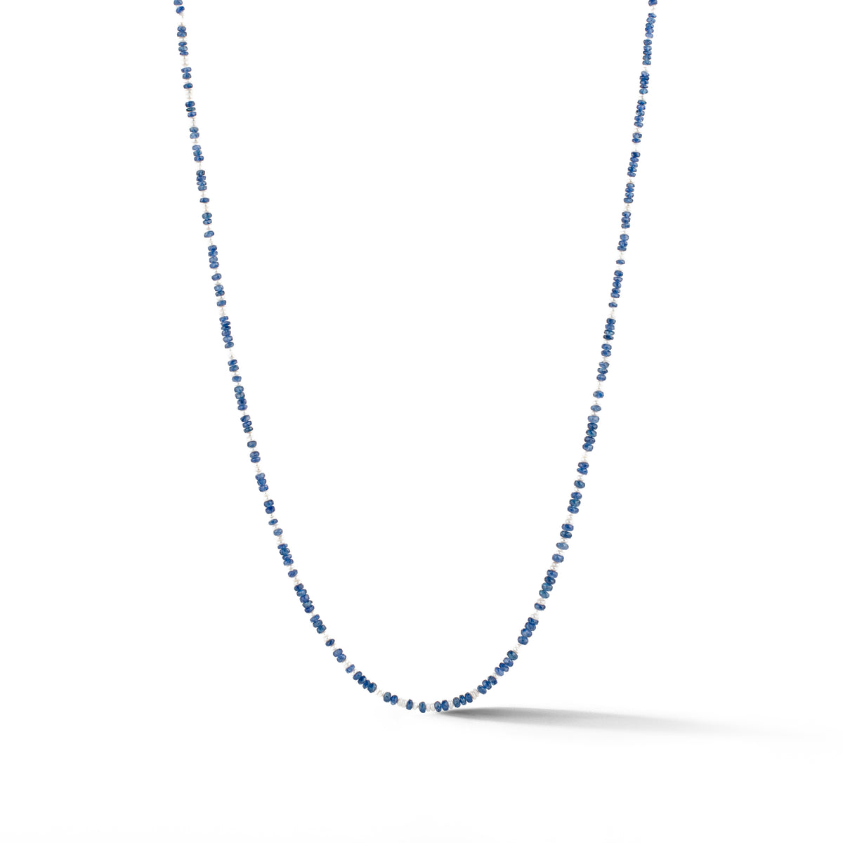 Beaded necklace of petite faceted blue sapphire rondels and freshwater pearls with a 14k yellow gold toggle catch