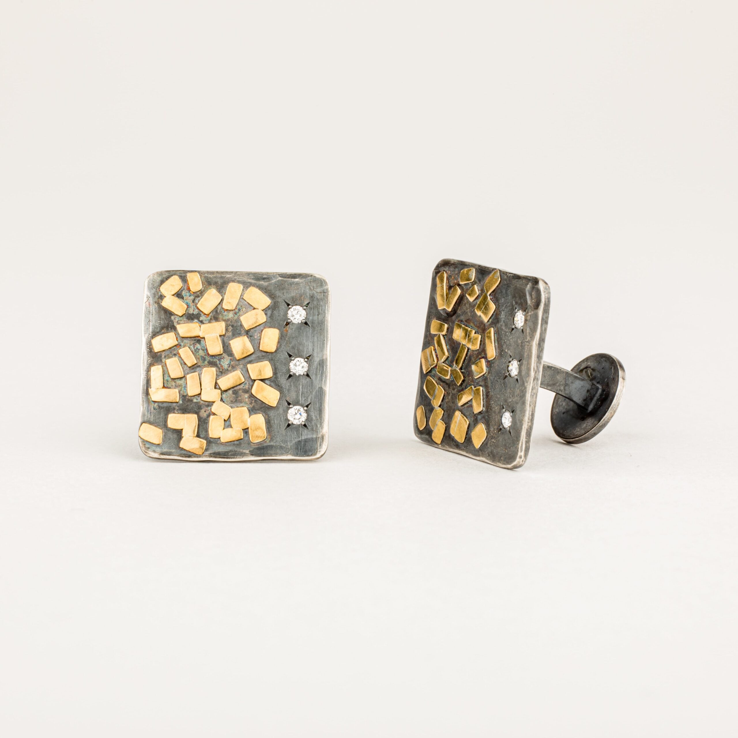Men's oxidized sterling silver square cufflinks with scattered 22k yellow gold flake accents and diamond star settings