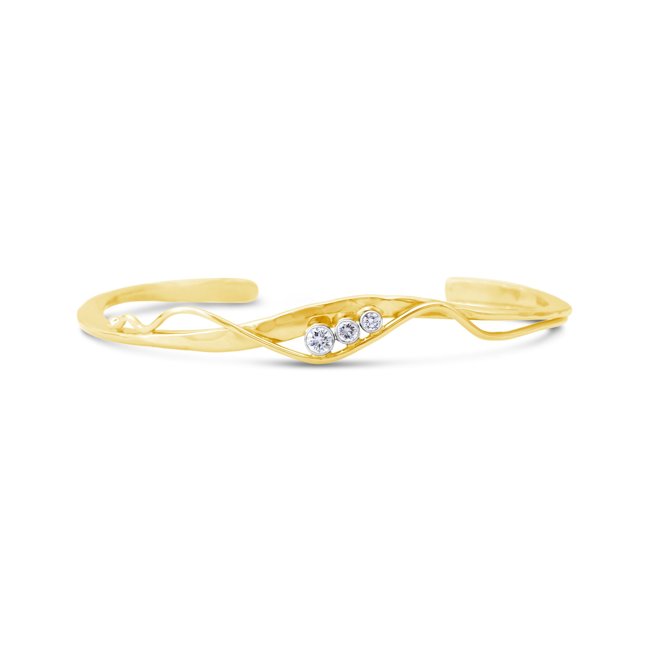 14k yellow gold hand-forged cuff bracelet with hammered texture, curved wire accent, and three bezel-set round diamonds, The Hathorn