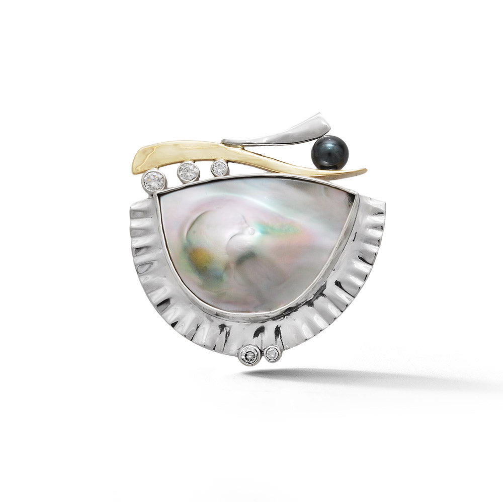 One-of-a-kind platinum and 18K yellow gold brooch featuring an iridescent abalone shell with a fluted bezel, bezel-set diamonds, and a black freshwater pearl accent