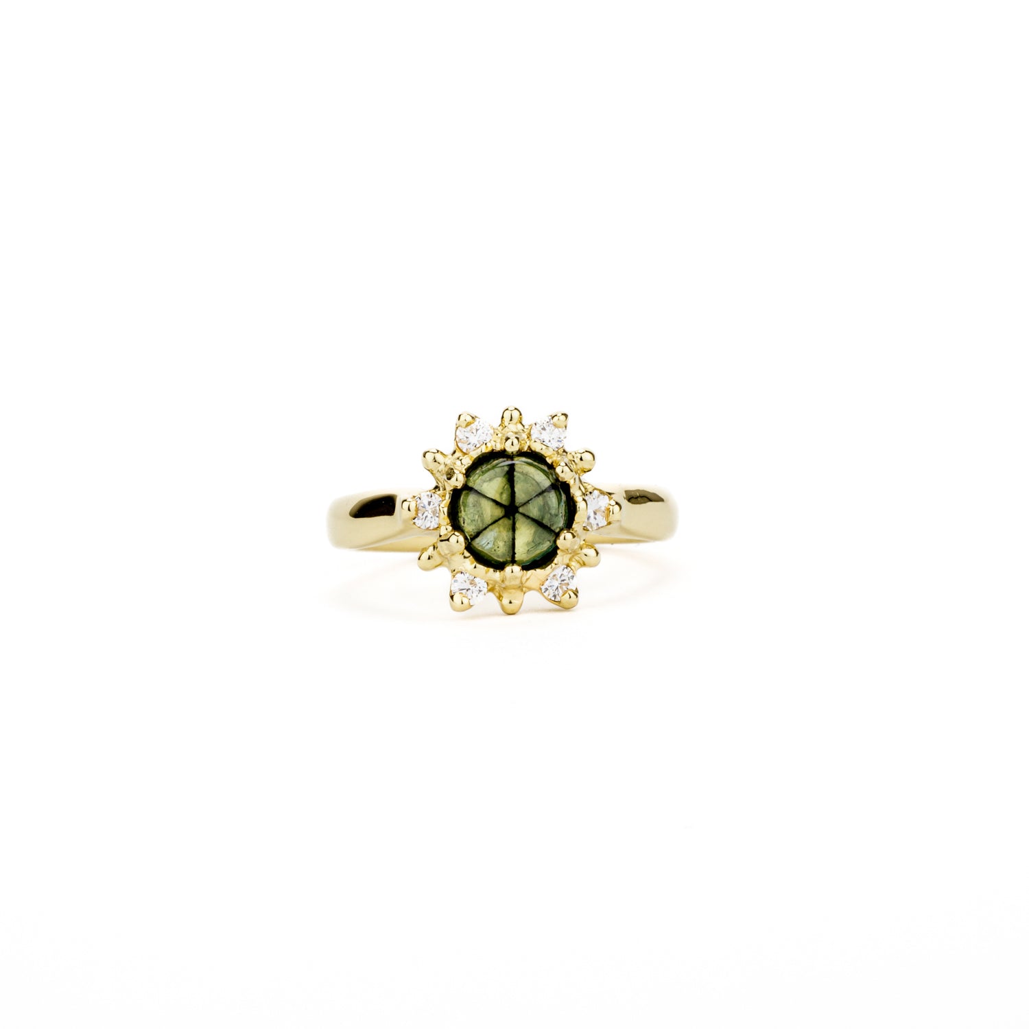 One-of-a-kind 18K yellow gold ring featuring a rare trapiche emerald with a natural radial pattern, surrounded by a diamond and gold bead sunburst halo