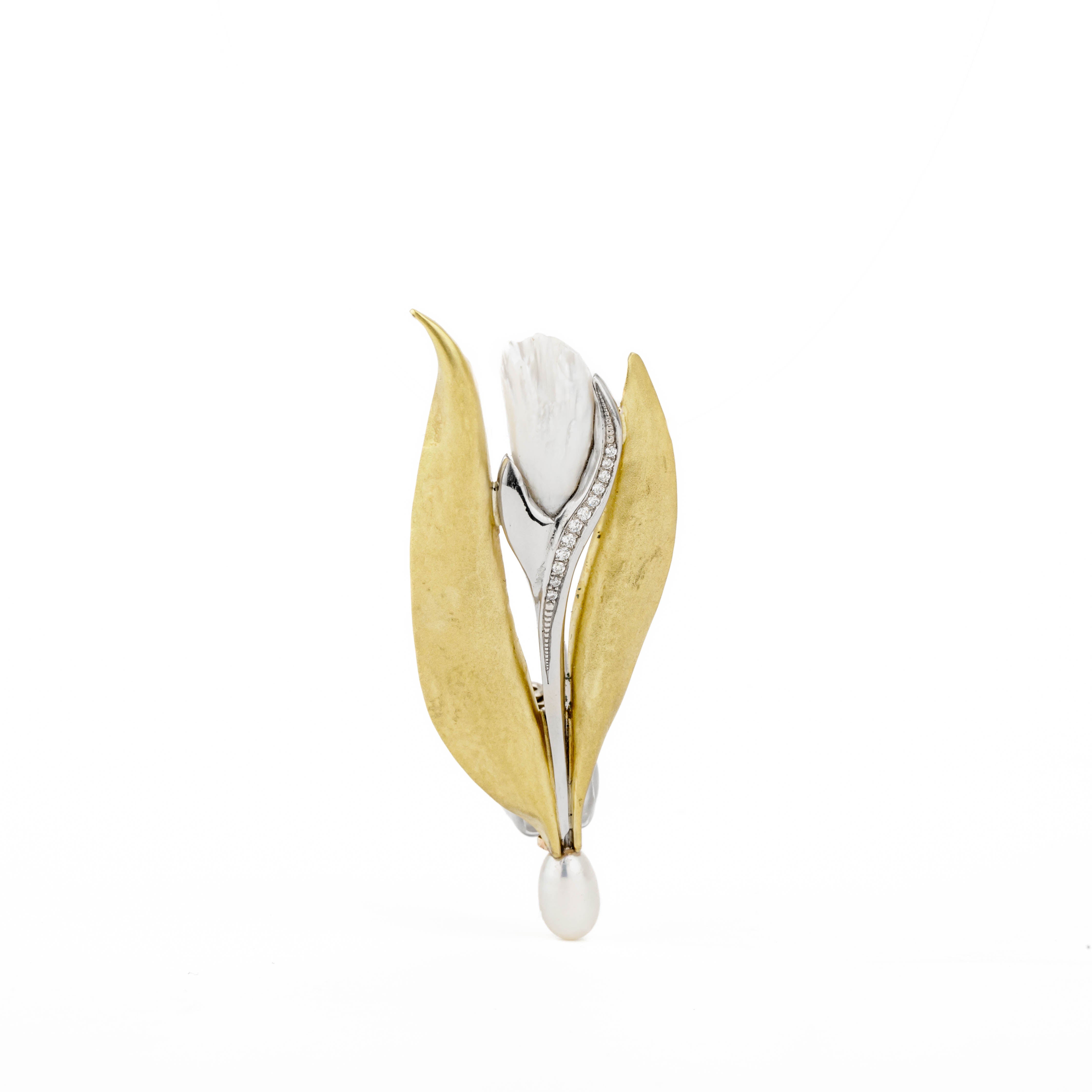 Platinum and 18k yellow gold tulip brooch featuring carved Tennessee River pearl, diamond-set stem, and freshwater pearl drop