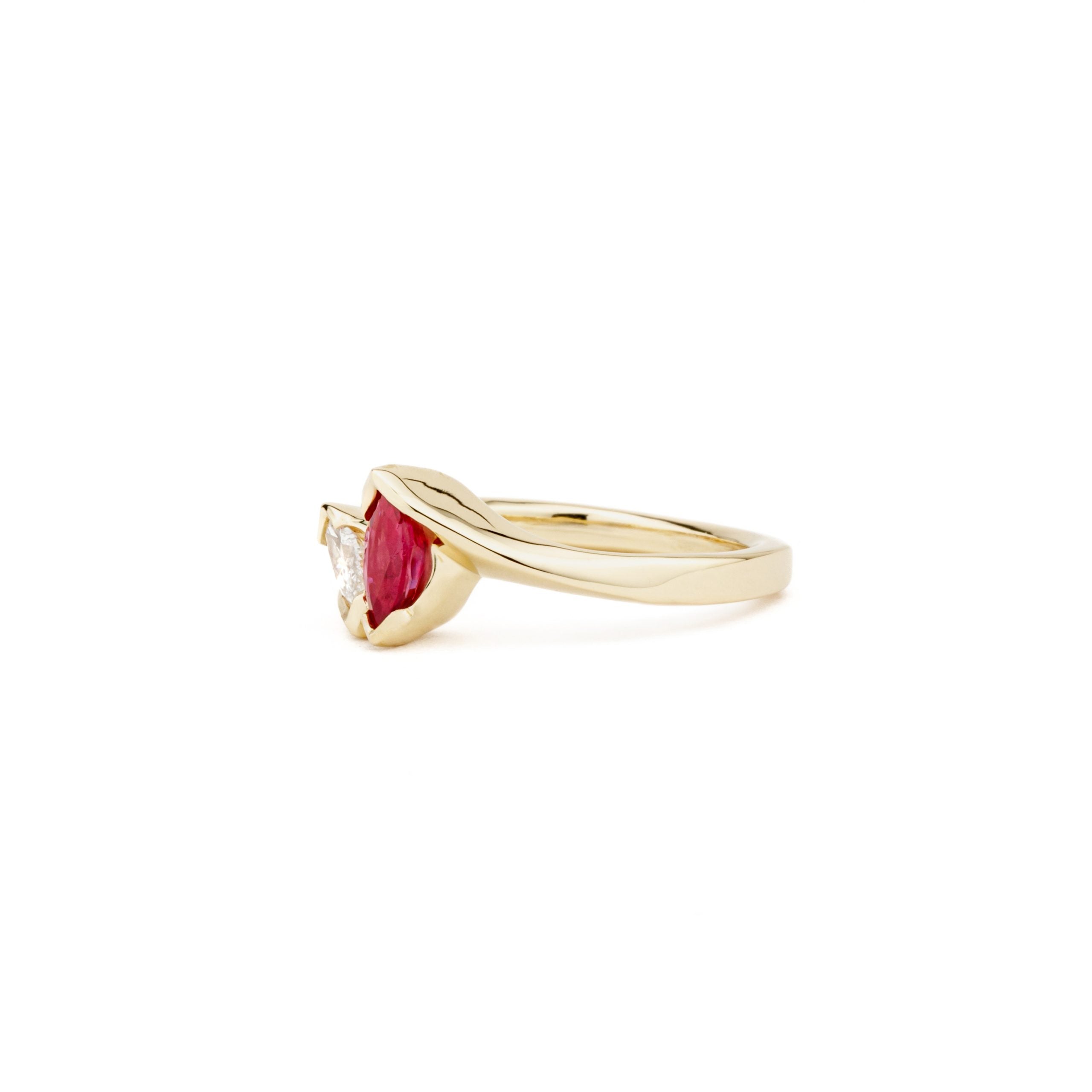 14k yellow gold bypass ring with marquise ruby and diamond in V-prong settings