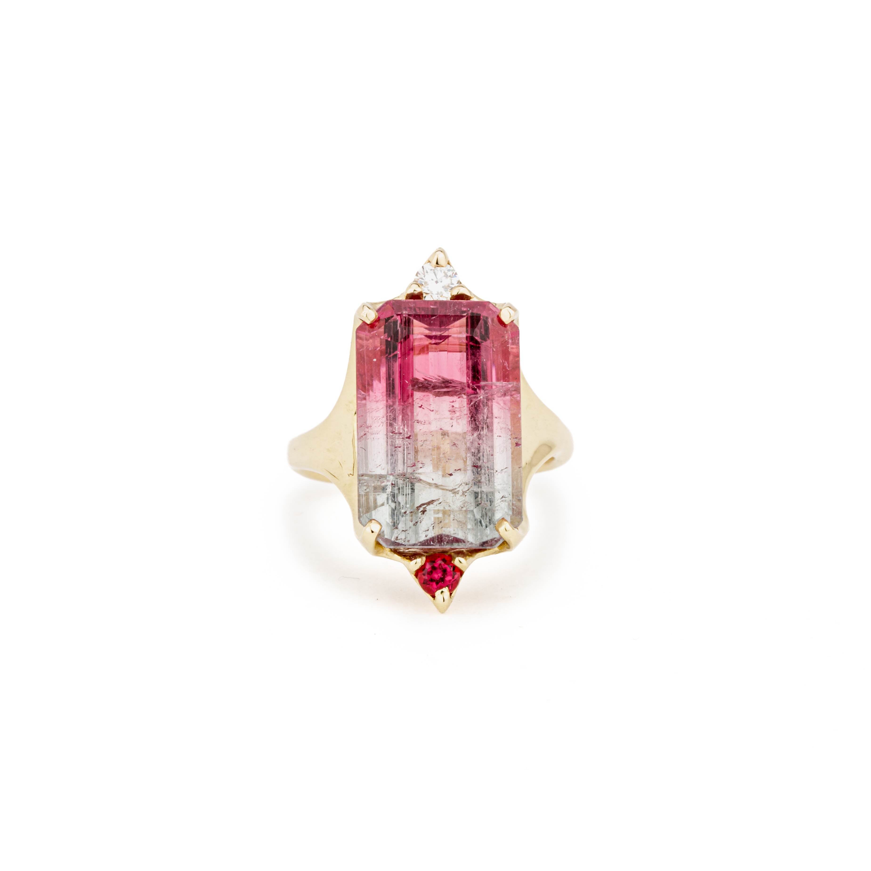 14k yellow gold ring with an emerald cut bi-color pink and green tourmaline, diamond accent, and reddish sapphire accent, size 7.75
