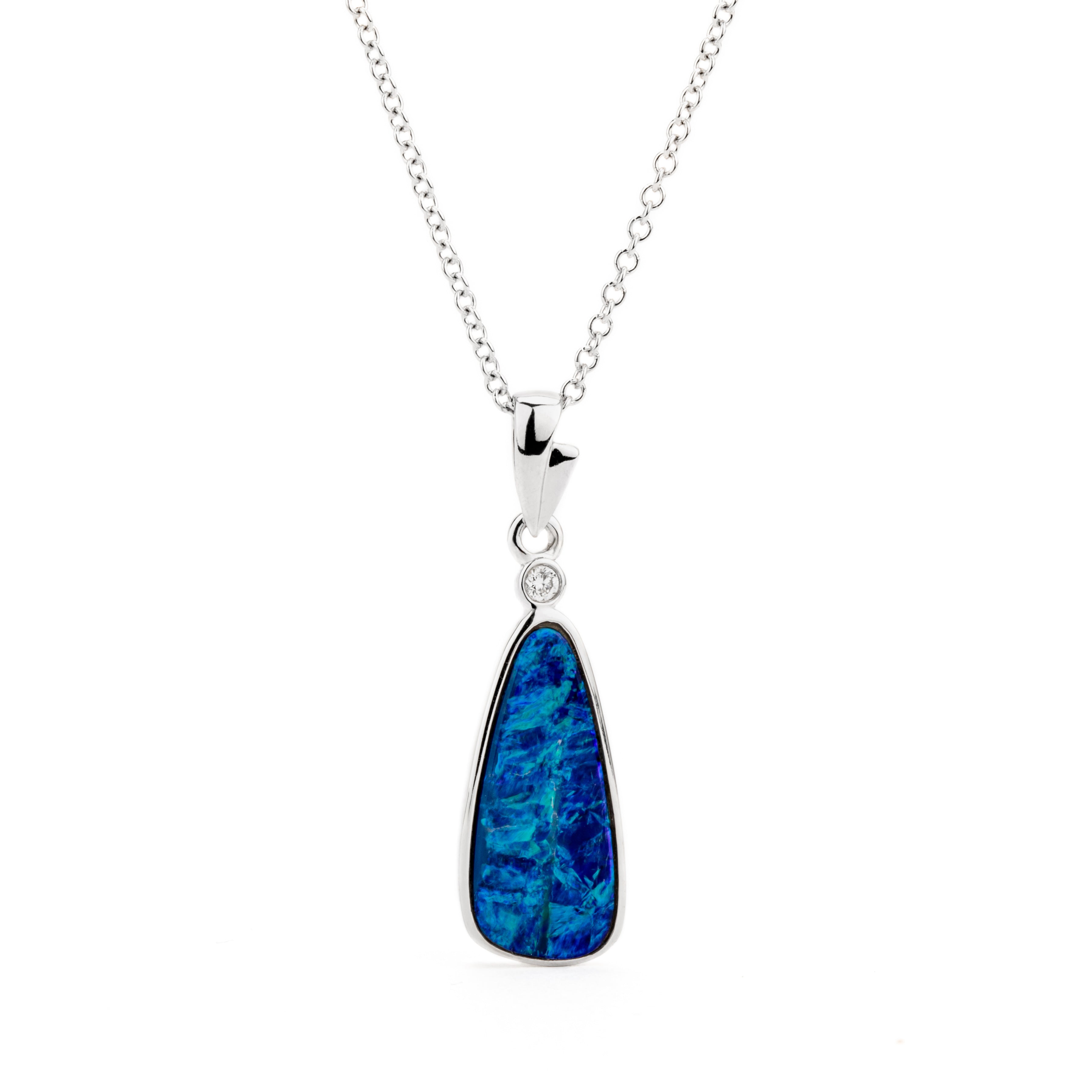 14k white gold pendant necklace featuring a deep blue freeform opal doublet with bezel-set diamond accent
