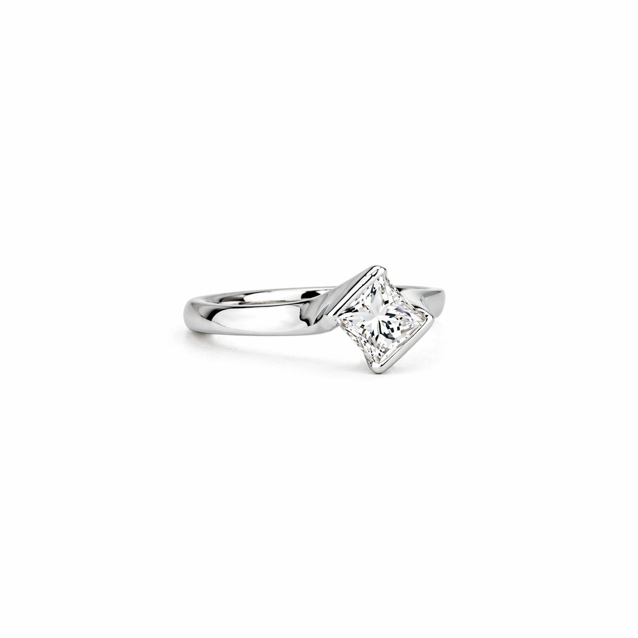 Platinum ring with angled princess-cut white diamond on a smooth, sculpted band against a clean white background