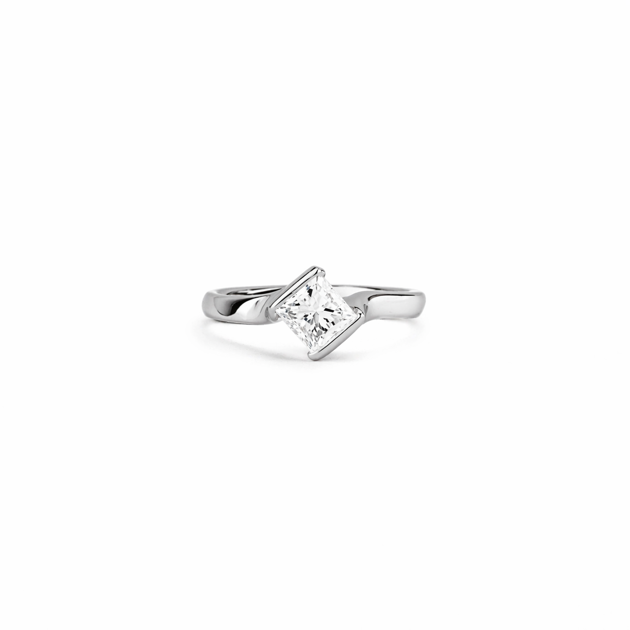 Platinum ring with angled princess-cut white diamond on a smooth, sculpted band against a clean white background