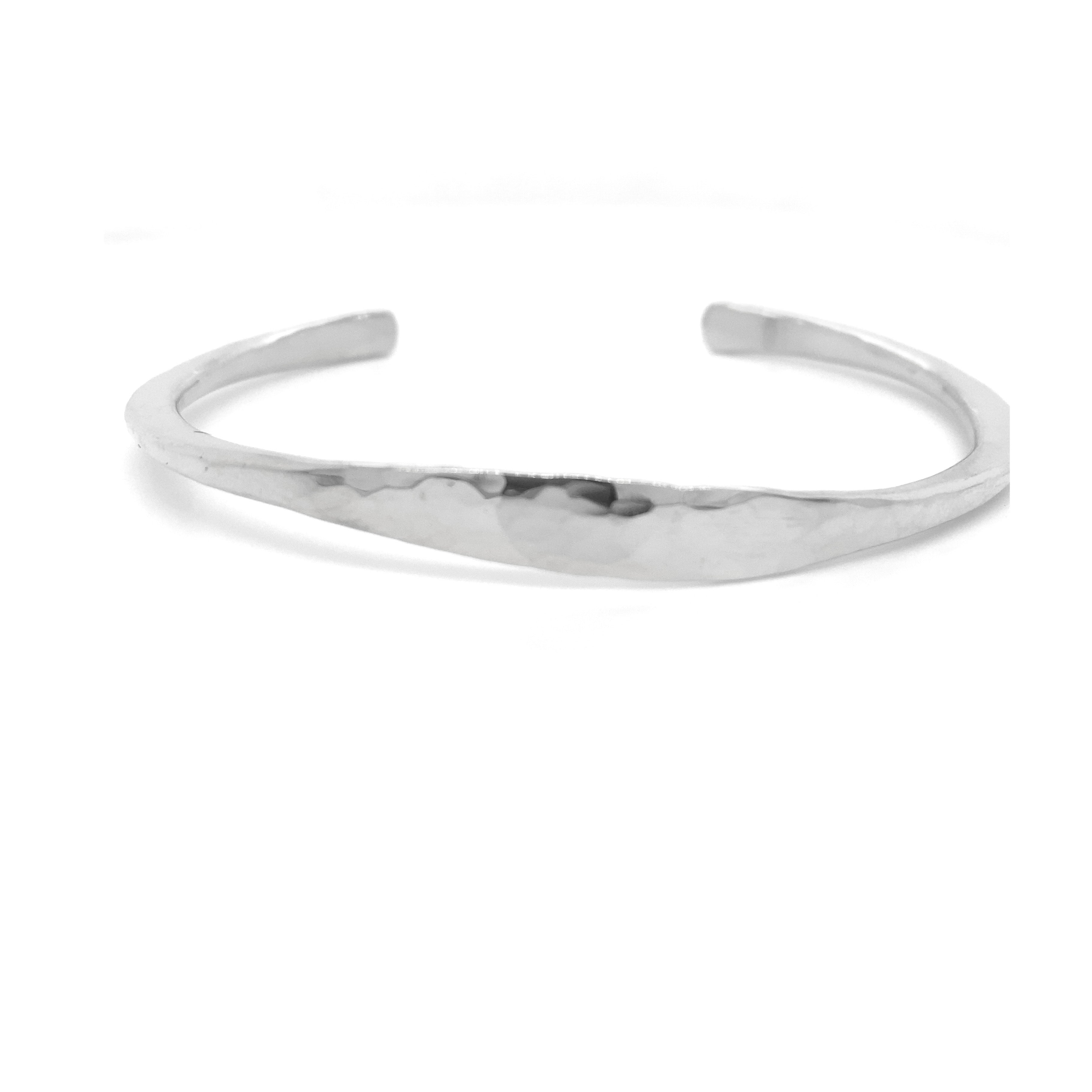 14k white gold hand-forged wide flair cuff bracelet with hammered texture and tapered ends